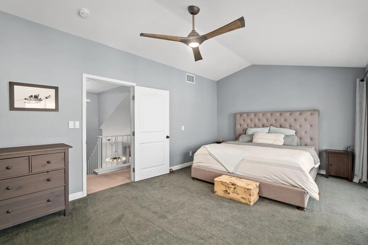 10145 Greenleaf Road Spring Valley, CA 91977 - Photo 26 of 37 a spacious bedroom with a bed and a chandelier