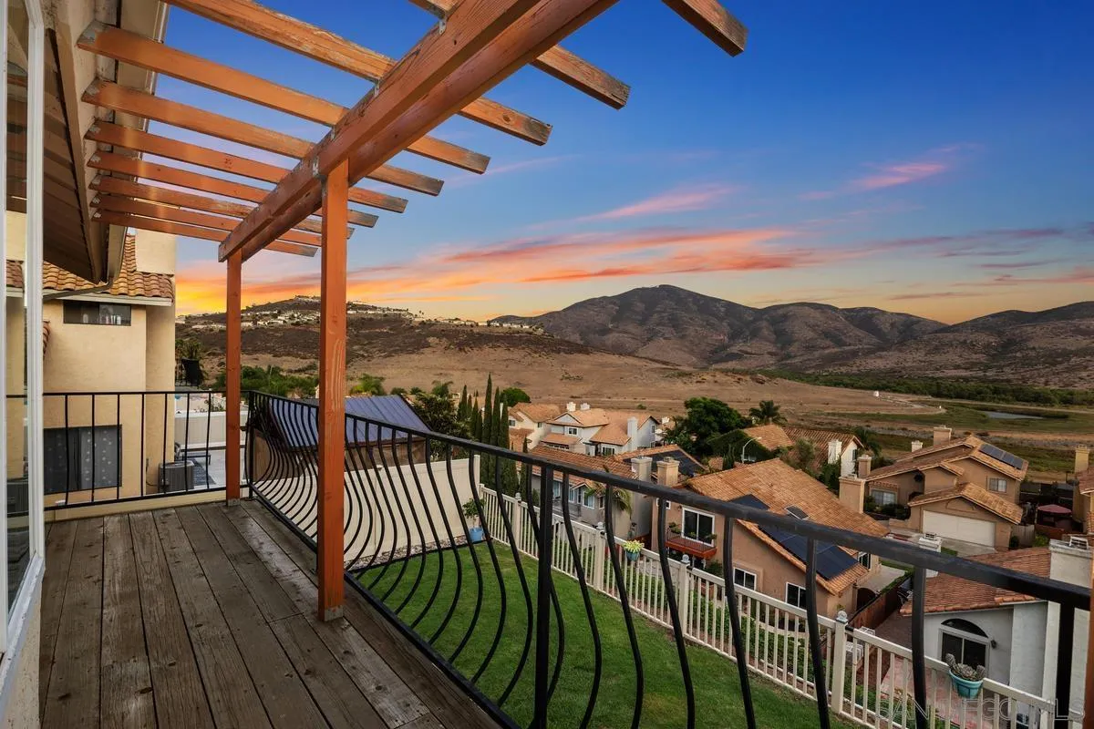 10145 Greenleaf Road Spring Valley, CA 91977 - Photo 3 of 37 a view of a balcony with wooden floor and fence