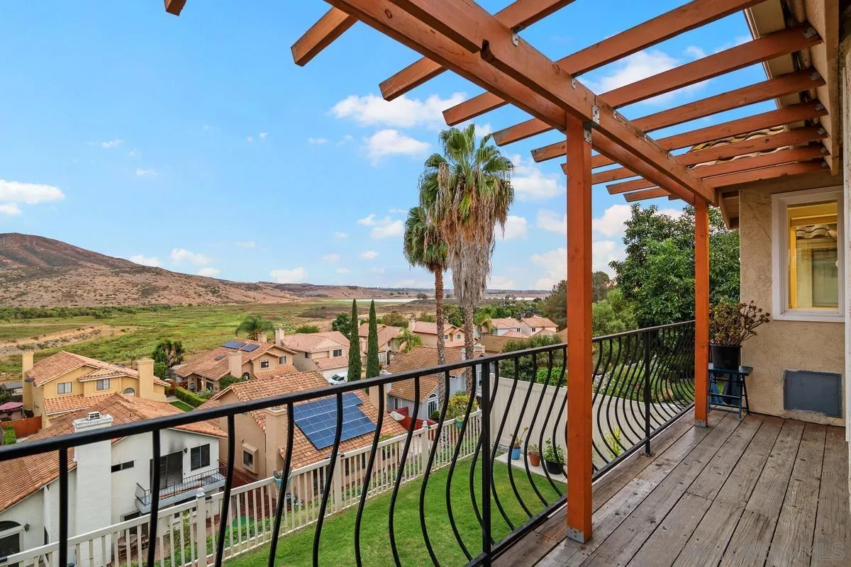 10145 Greenleaf Road Spring Valley, CA 91977 - Photo 34 of 37 a view of a balcony with wooden floor and fence