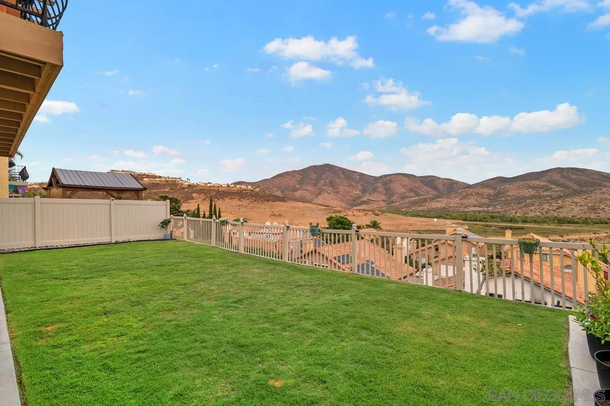 10145 Greenleaf Road Spring Valley, CA 91977 - Photo 7 of 37 a view of a lake with a mountain in the background