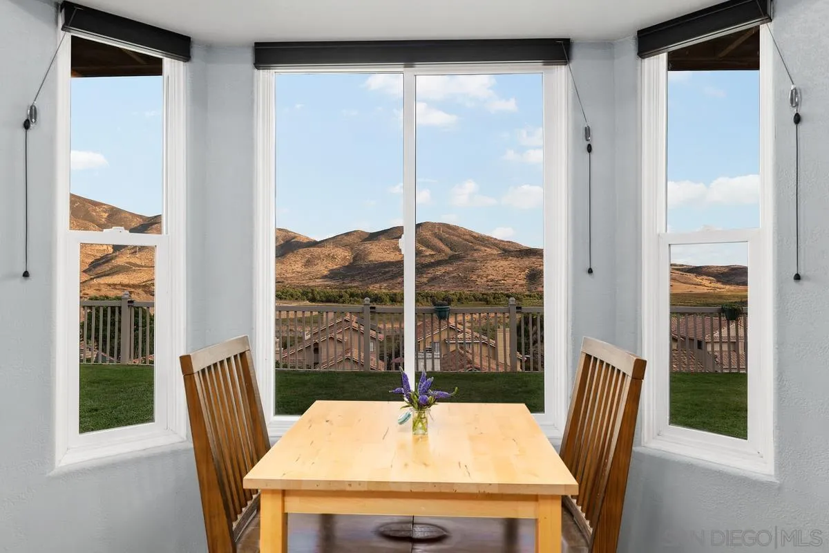 10145 Greenleaf Road Spring Valley, CA 91977 - Photo 9 of 37 a view of a dining room with furniture window and outside view