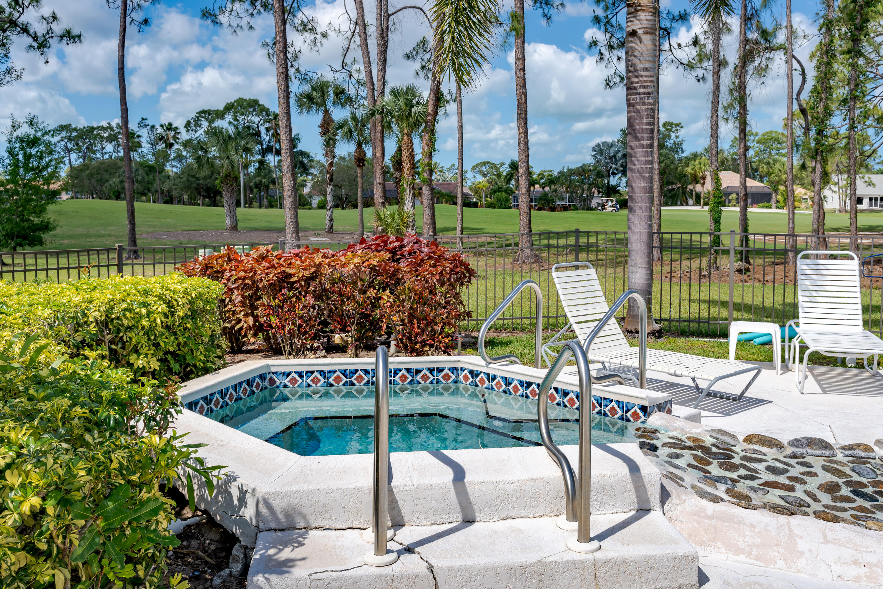 809 Augusta Boulevard, Unit 6 Naples, FL 34113 - Photo 21 of 24 a view of a backyard with a patio