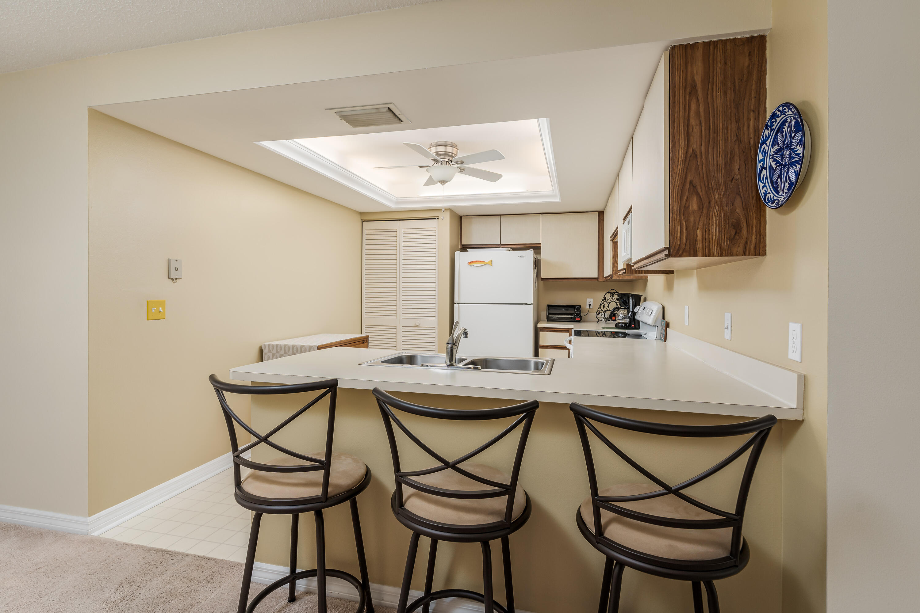 809 Augusta Boulevard, Unit 6 Naples, FL 34113 - Photo 3 of 24 a kitchen with a table and chairs in it