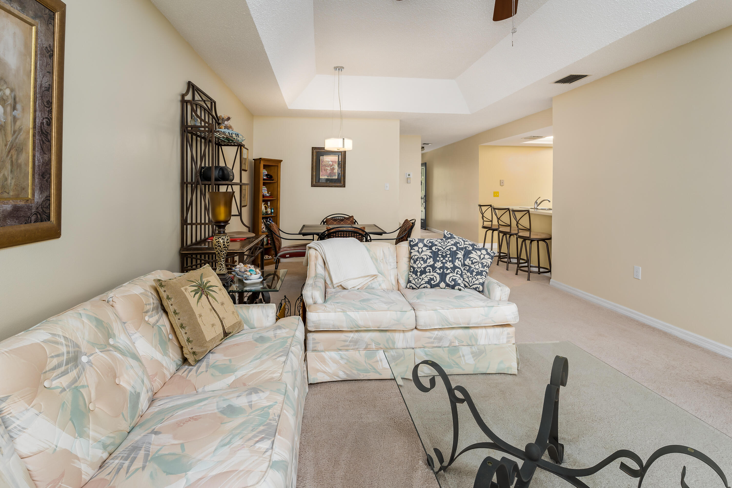 809 Augusta Boulevard, Unit 6 Naples, FL 34113 - Photo 5 of 24 a living room with furniture and a couch