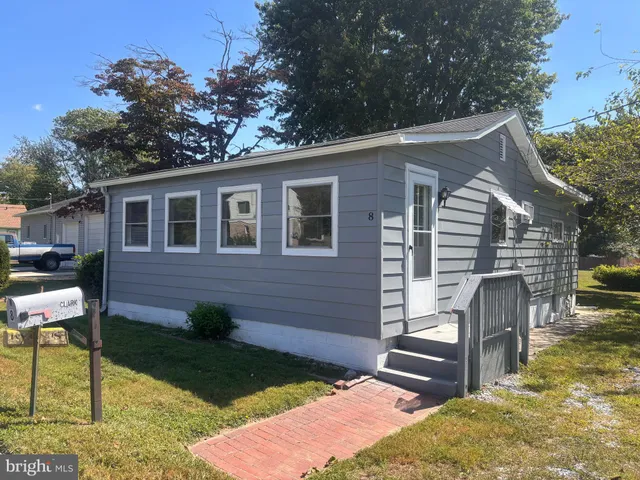 a backyard of a house with seating space