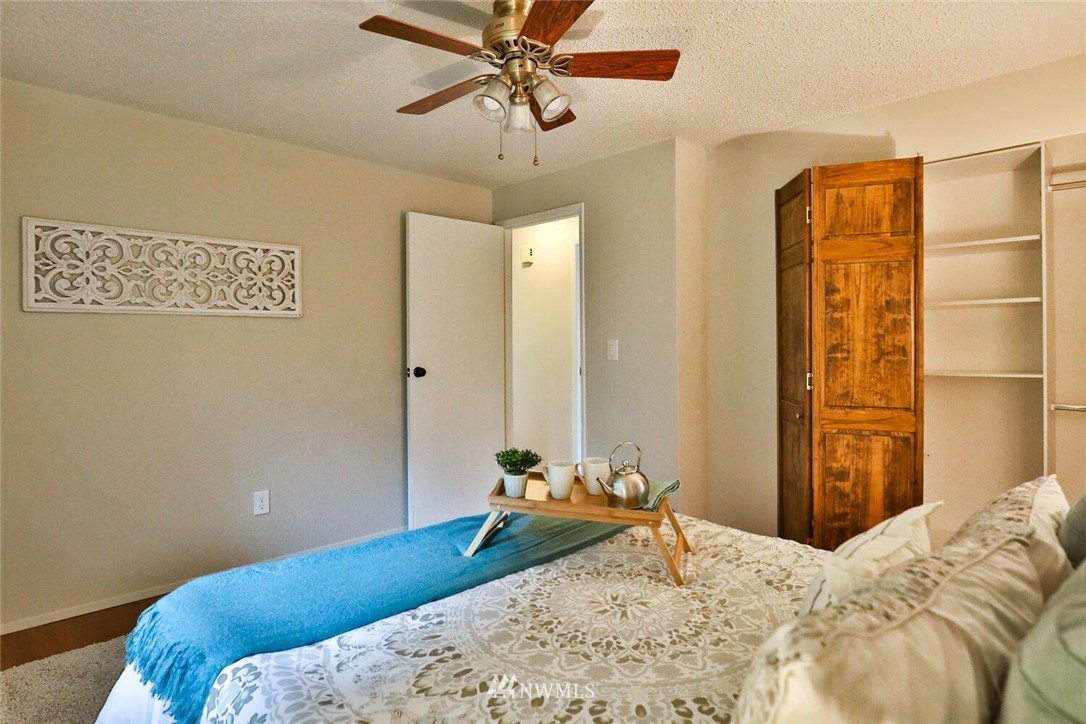 1933 169th Place Southeast Bothell, WA 98012 - Photo 16 of 34 a bedroom with a bed and a dresser
