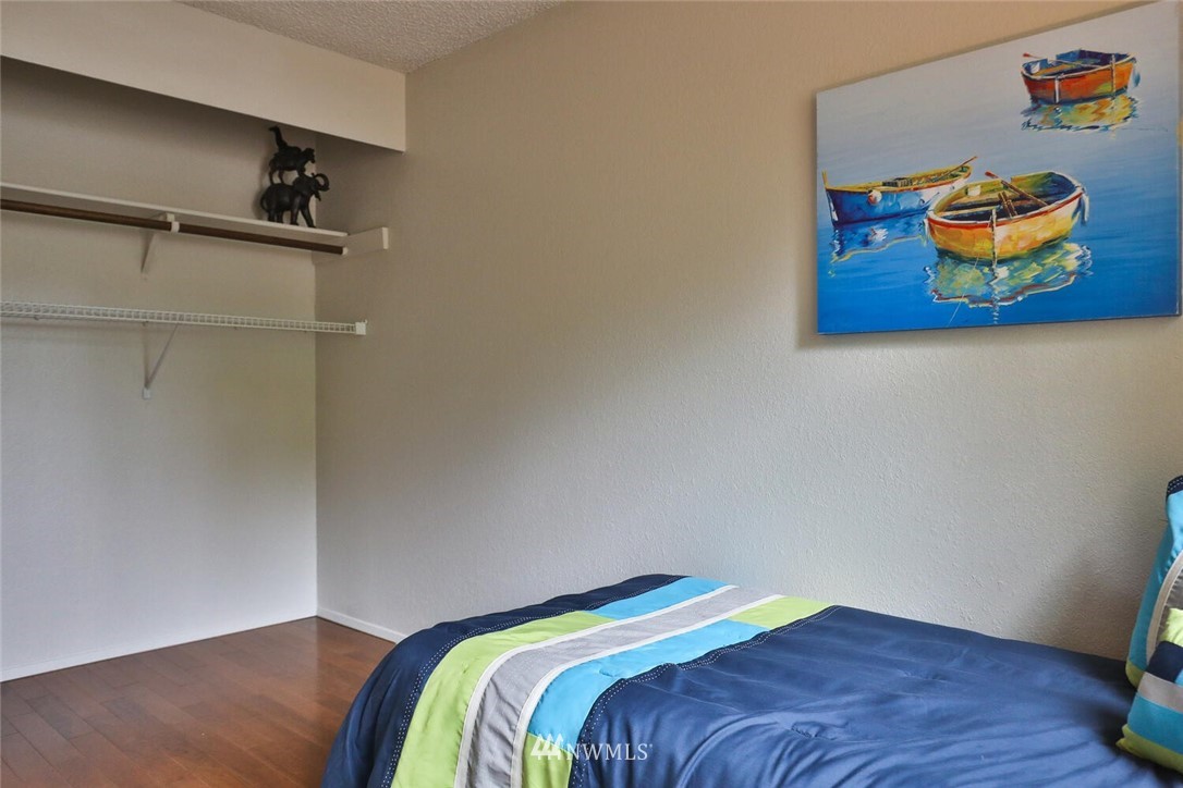 1933 169th Place Southeast Bothell, WA 98012 - Photo 18 of 34 a bedroom with a bed and painting on the wall