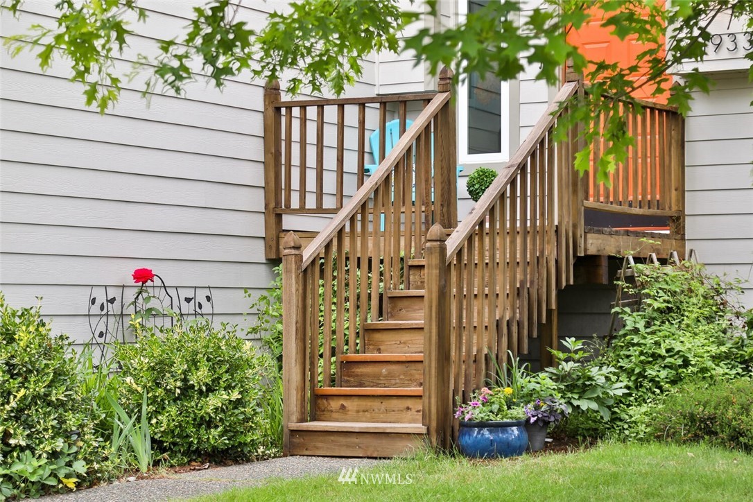 1933 169th Place Southeast Bothell, WA 98012 - Photo 3 of 34 a view of entryway with flower plants and wooden fence
