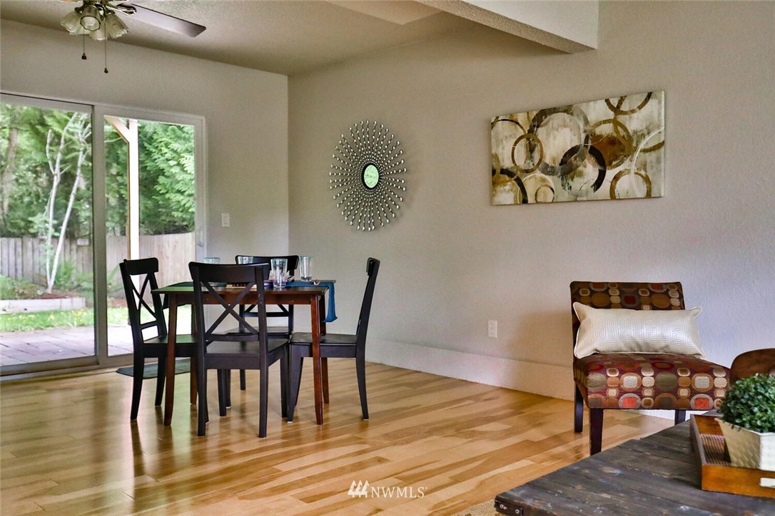 1933 169th Place Southeast Bothell, WA 98012 - Photo 21 of 34 a view of a dining room with furniture window and wooden floor