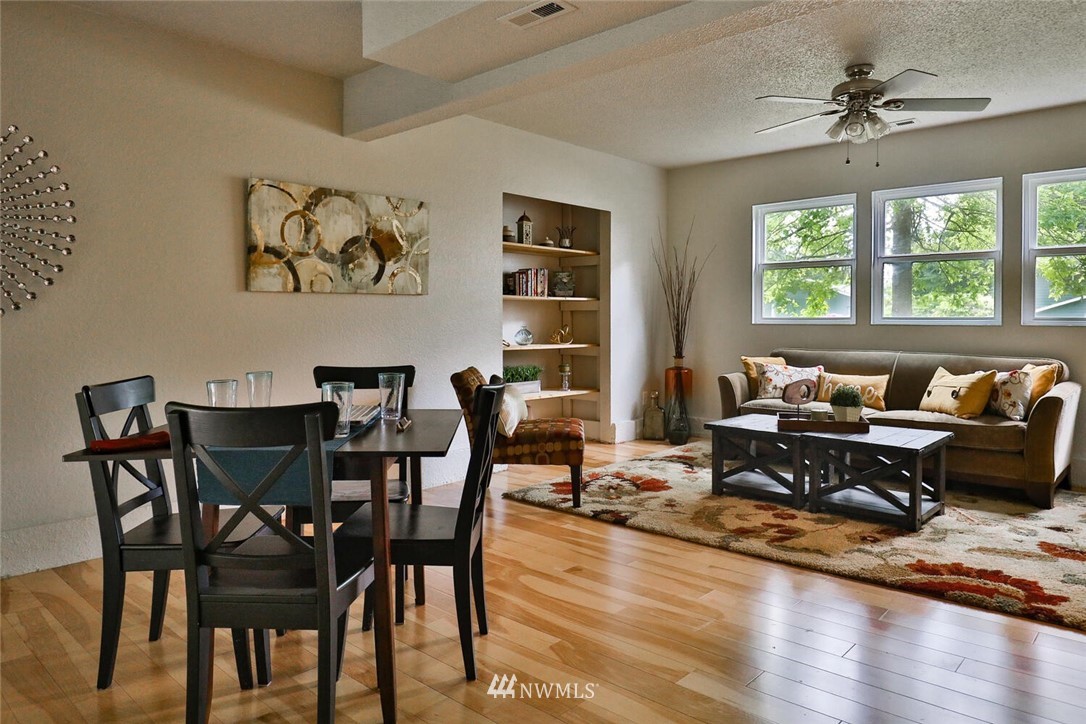1933 169th Place Southeast Bothell, WA 98012 - Photo 22 of 34 a view of a dining room with furniture window and wooden floor