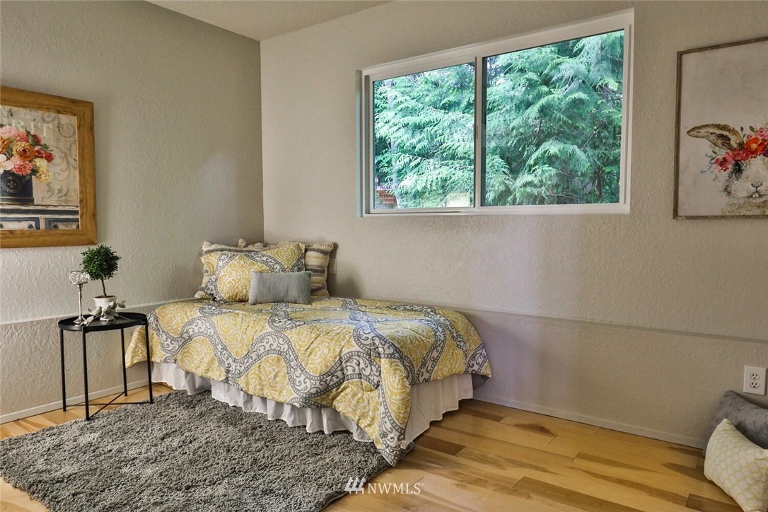 1933 169th Place Southeast Bothell, WA 98012 - Photo 24 of 34 a bedroom with a bed and a window