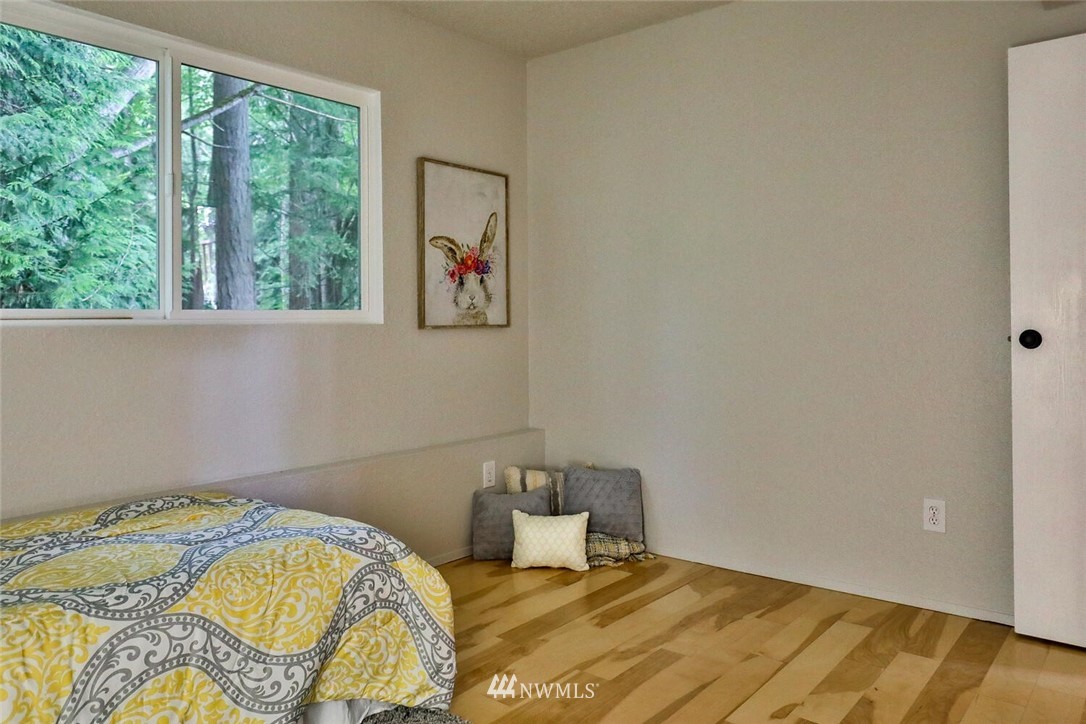 1933 169th Place Southeast Bothell, WA 98012 - Photo 25 of 34 a bedroom with a bed and a window