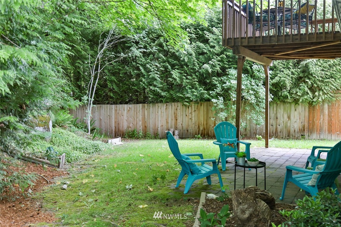 1933 169th Place Southeast Bothell, WA 98012 - Photo 29 of 34 a view of a chairs and table in backyard of the house