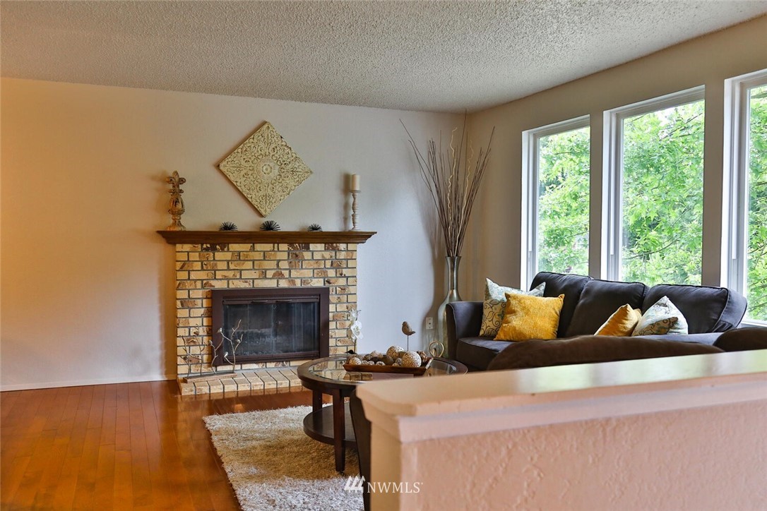 1933 169th Place Southeast Bothell, WA 98012 - Photo 6 of 34 a living room with furniture and a fireplace
