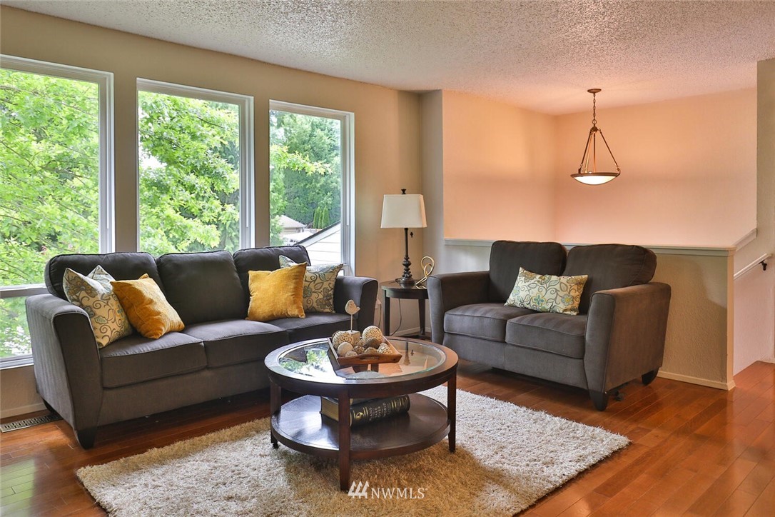 1933 169th Place Southeast Bothell, WA 98012 - Photo 7 of 34 a living room with furniture and a large window