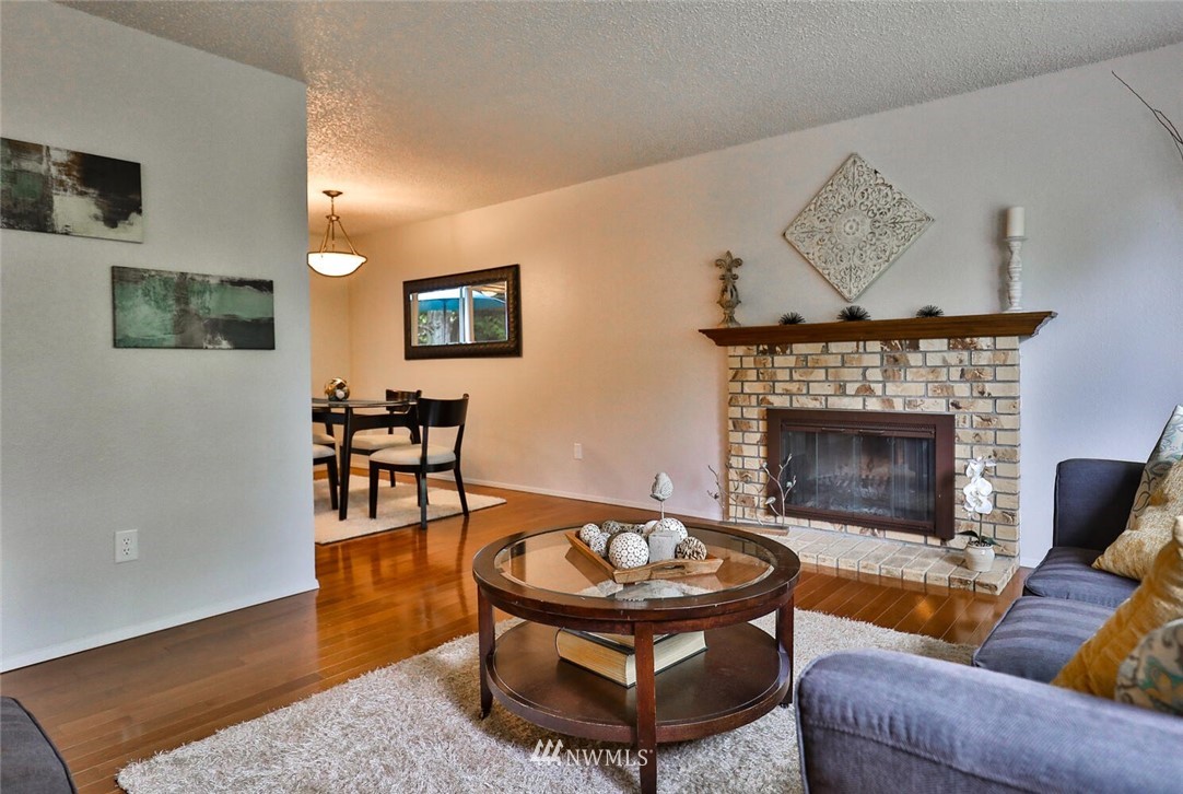 1933 169th Place Southeast Bothell, WA 98012 - Photo 8 of 34 a living room with furniture and a fireplace