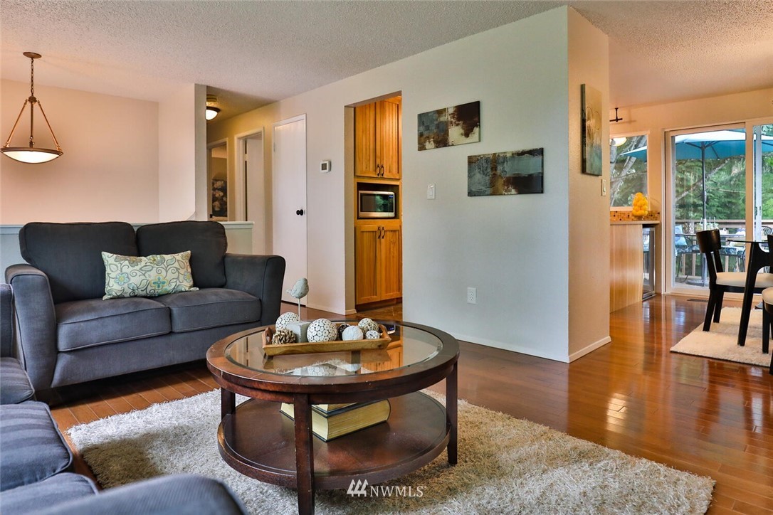1933 169th Place Southeast Bothell, WA 98012 - Photo 9 of 34 a living room with furniture and a wooden floor