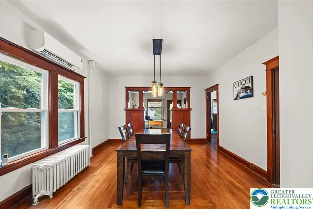 a view of a dining room with furniture window and wooden floor