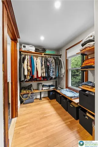 a kitchen with stainless steel appliances granite countertop a refrigerator and wooden cabinets