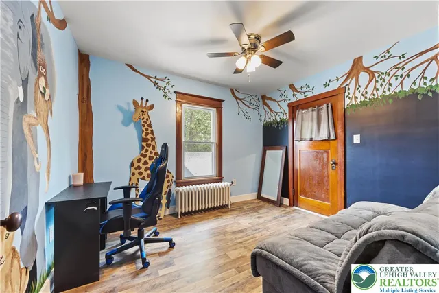 a bedroom with furniture and a window