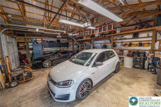 a view of parking garage with cars and other equipment
