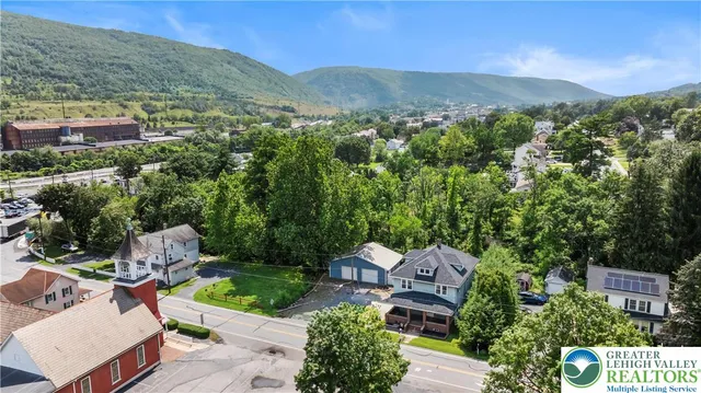an aerial view of a house with a garden