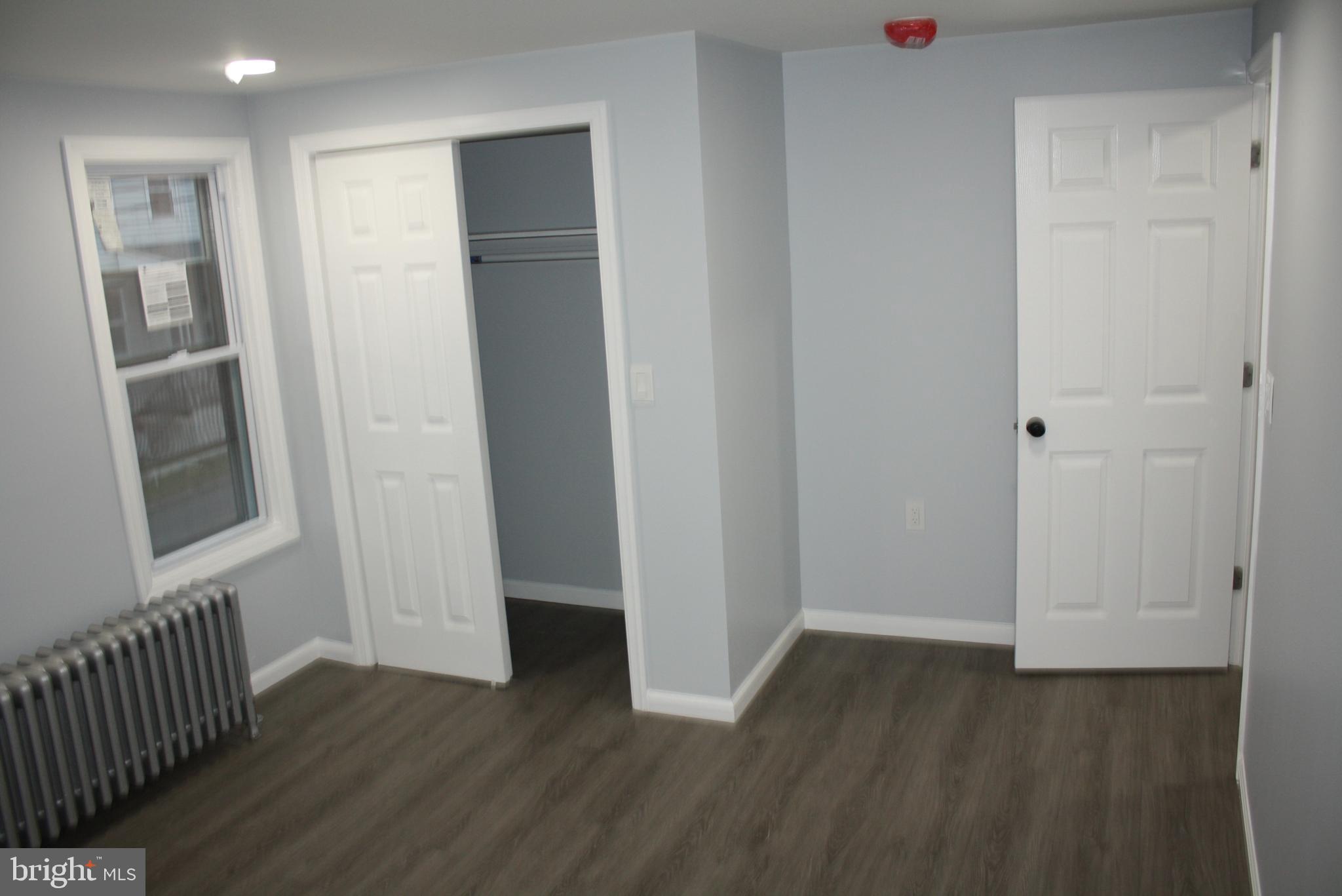 36 Chestnut Street Cressona, PA 17929 - Photo 13 of 28 an empty room with wooden floor and windows