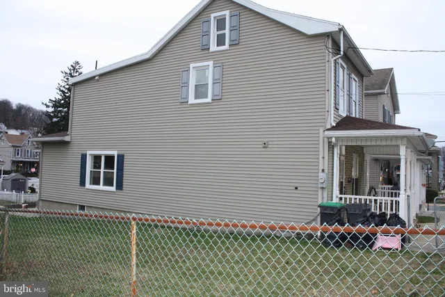 a front view of a house with a garage