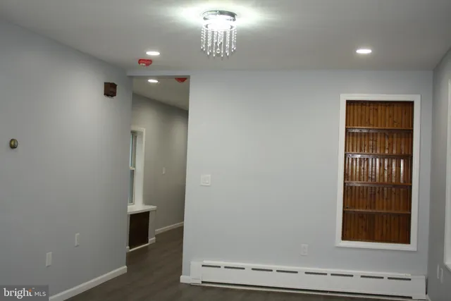 a view of an entryway with wooden floor