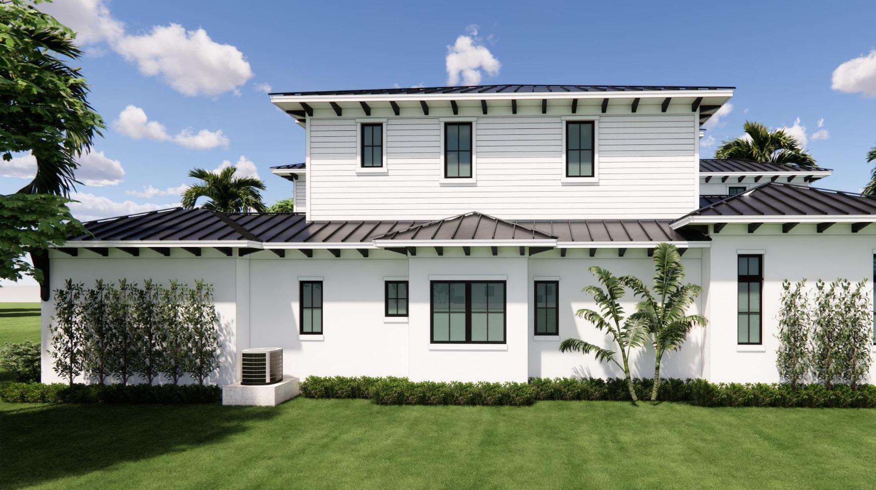 633 Kingfish Road North Palm Beach, FL 33408 - Photo 13 of 38 a view of a white house with a yard potted plants and a table