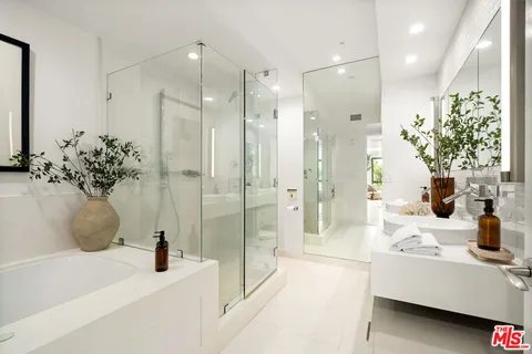 a bathroom with a bathtub and shower
