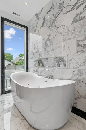 a bathroom with a granite countertop sink a toilet and a mirror