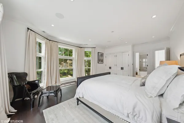 a bedroom with a bed and a lamp