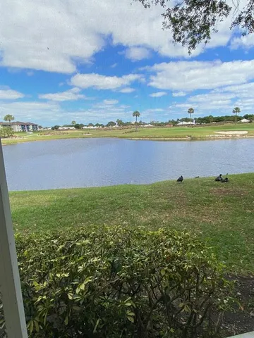 a view of a lake with a big yard