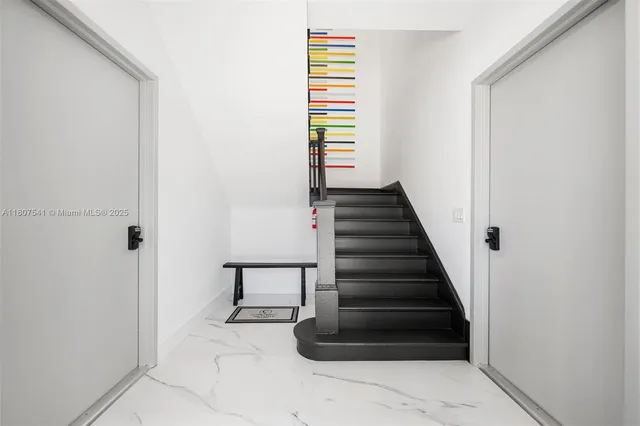 a view of entryway and hall with a window