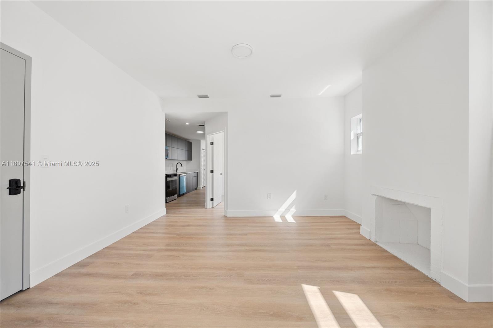 403 Southwest 12th Avenue, Unit 4 Miami, FL 33130 - Photo 13 of 24 a view of empty room with wooden floor