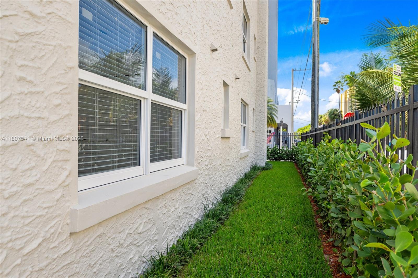 403 Southwest 12th Avenue, Unit 4 Miami, FL 33130 - Photo 18 of 24 a front view of a house with a yard