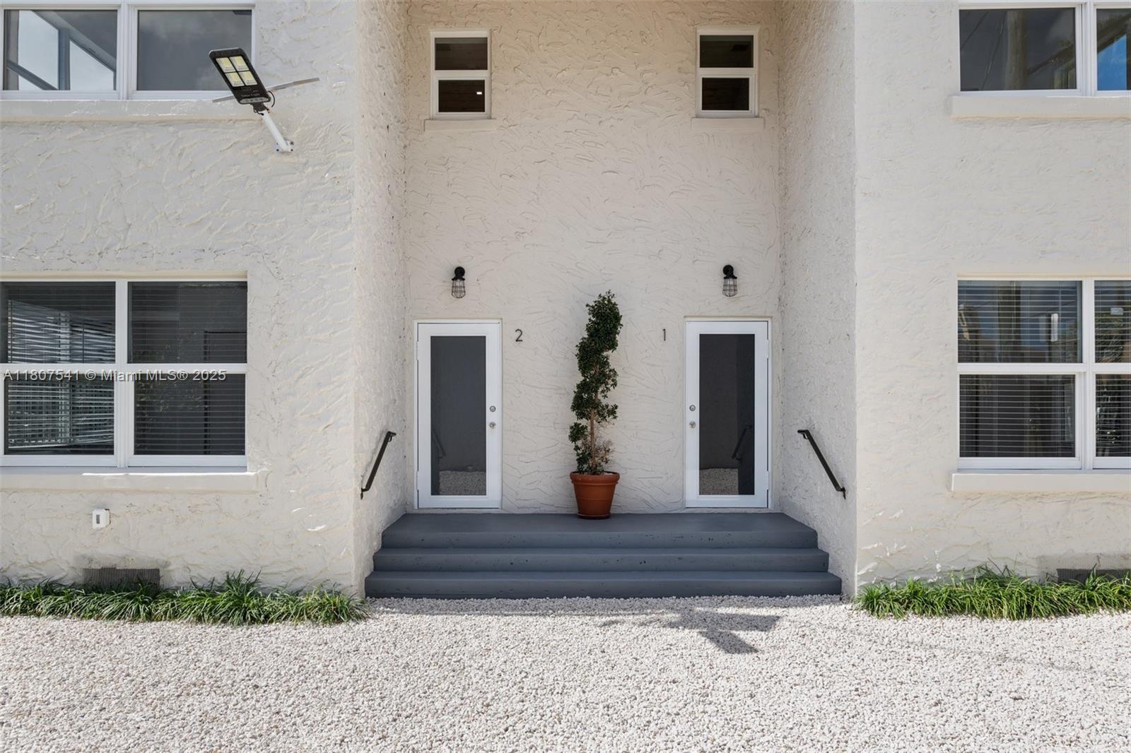 403 Southwest 12th Avenue, Unit 4 Miami, FL 33130 - Photo 19 of 24 a view of a house with a yard