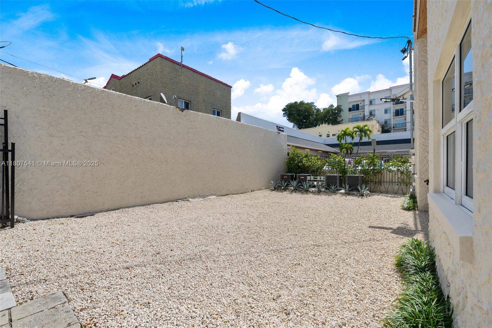 403 Southwest 12th Avenue, Unit 4 Miami, FL 33130 - Photo 20 of 24 a front view of a house with a yard