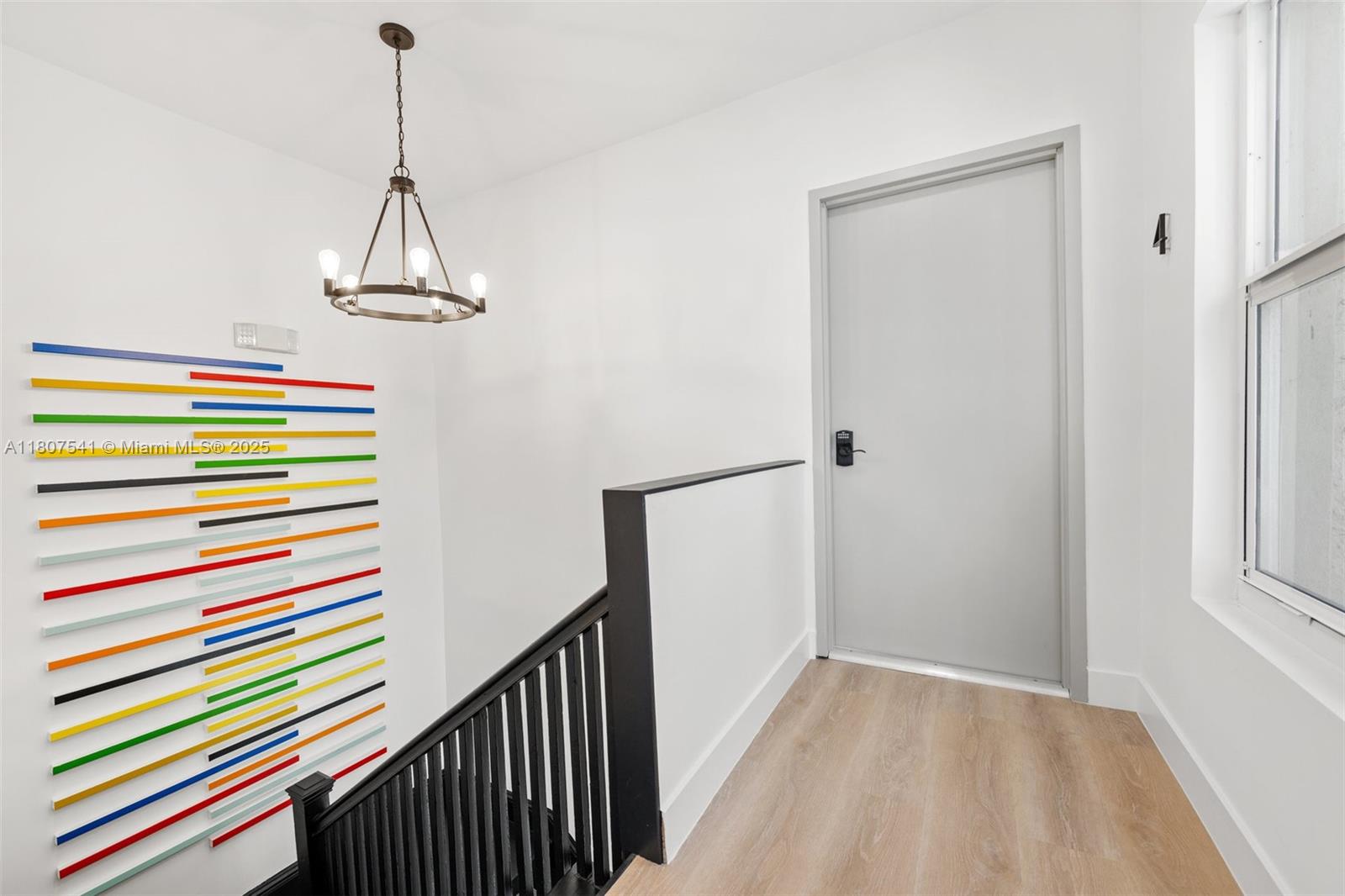 403 Southwest 12th Avenue, Unit 4 Miami, FL 33130 - Photo 2 of 24 a view of a hallway with a chandelier