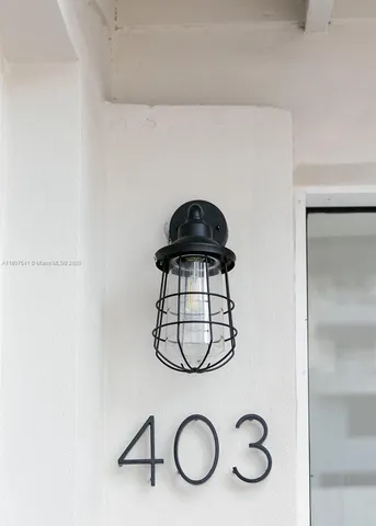 a palm tree sitting in front of a building