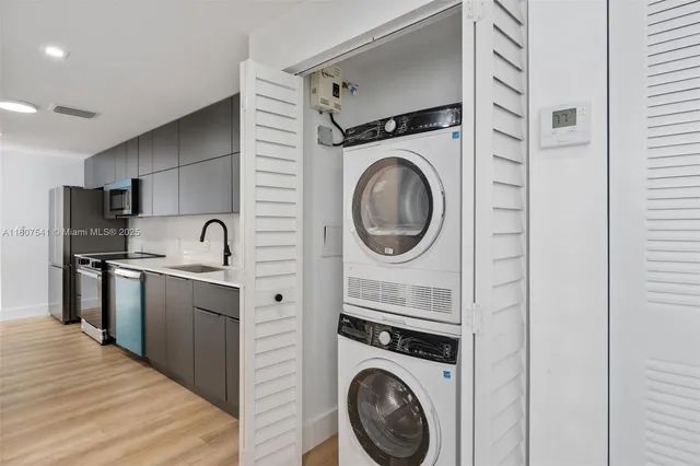 a kitchen with a washer and dryer