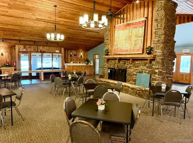 a view of a living room and kitchen with furniture