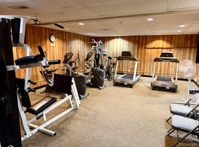a room with pool table and windows