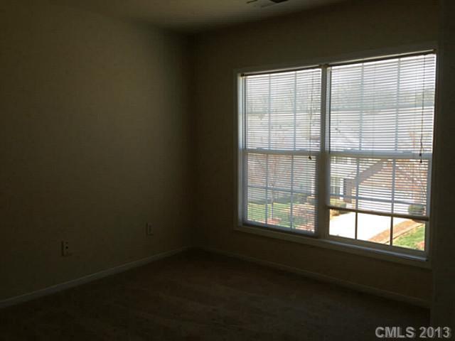 11406 Erwin Ridge Avenue Charlotte, NC 28213 - Photo 11 of 16 a view of an empty room with a window