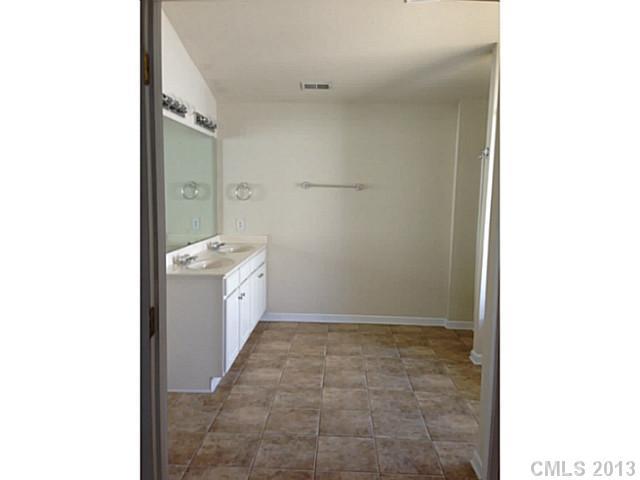 11406 Erwin Ridge Avenue Charlotte, NC 28213 - Photo 14 of 16 a bathroom with a sink a toilet and shower