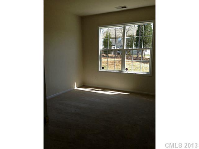 11406 Erwin Ridge Avenue Charlotte, NC 28213 - Photo 3 of 16 a view of an empty room with a window