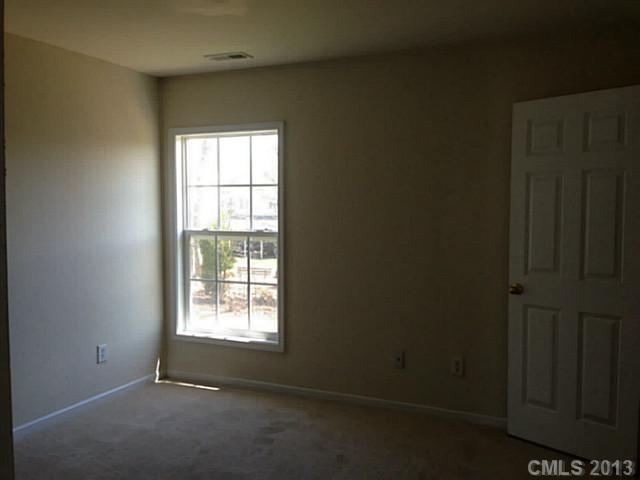 11406 Erwin Ridge Avenue Charlotte, NC 28213 - Photo 8 of 16 a view of an empty room with a window