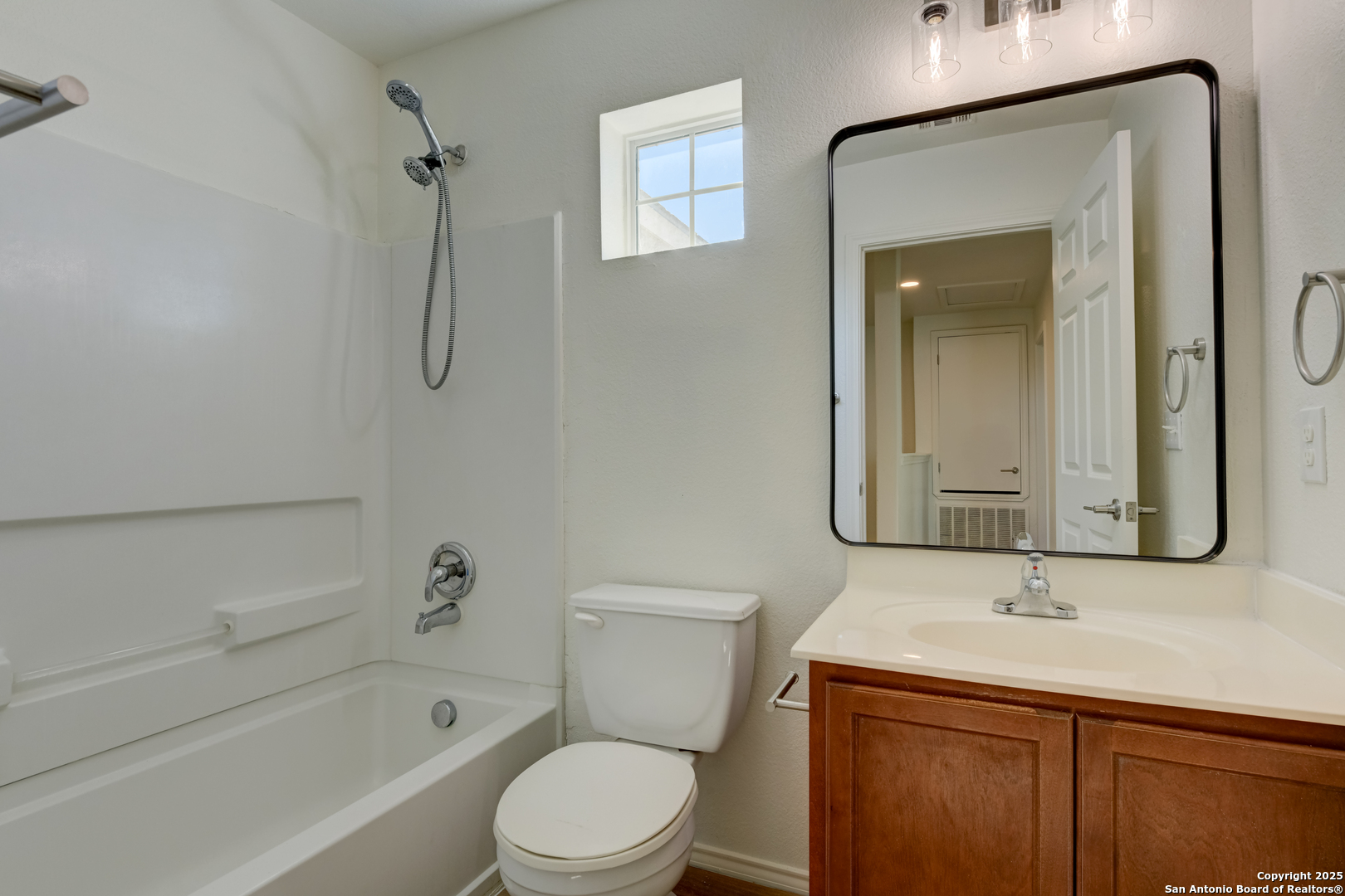9447 Copper Mist Converse, TX 78109 - Photo 13 of 25 a bathroom with a toilet sink vanity tub and shower