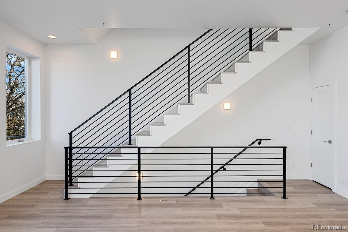 1624 Irving Street, Unit 1 Denver, CO 80204 - Photo 11 of 35 a view of entryway and hall with wooden floor
